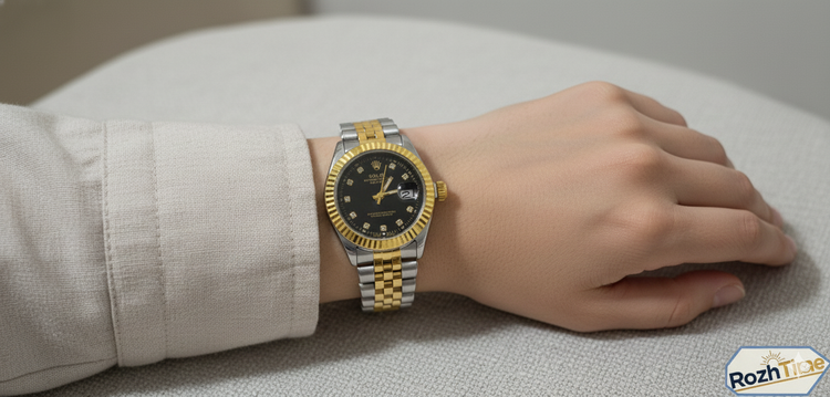 ساعت طرح رولکس زنانه استیل تقویم دار صفحه مشکی بند طلایی نقره ای